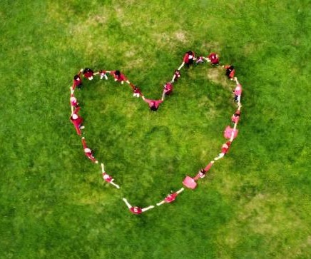 People gather in Sefton Park, Liverpool, to mark World Heart Day